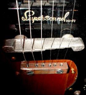 Close up of an electric guitar pickup by Supersound